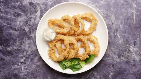 cooked squid rings and shrimp on a plate top view ,