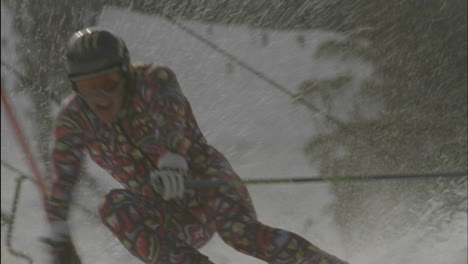 a person skies down hill around a slalom