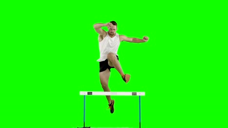 atleta hombre corriendo y saltando obstáculos