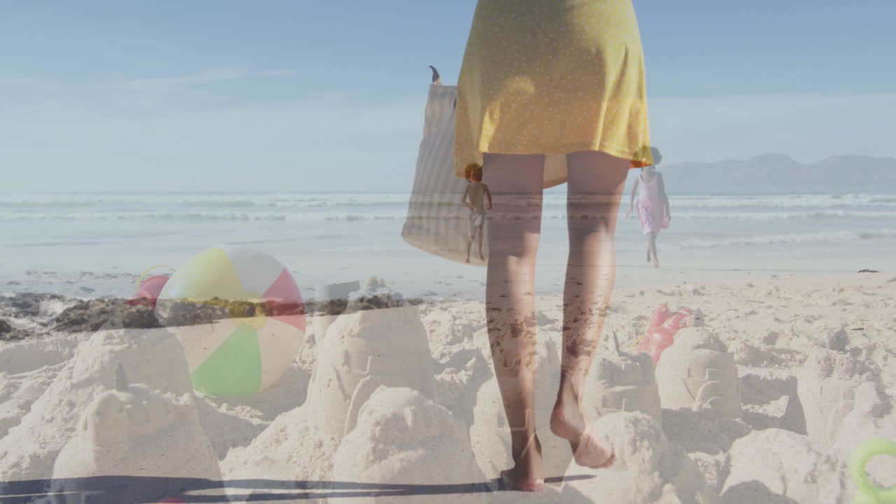 Mother walking toward waves, children playing with animated business chart above sandcastles