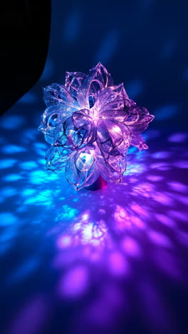 vibrant pink and blue lotus lamp with light patterns