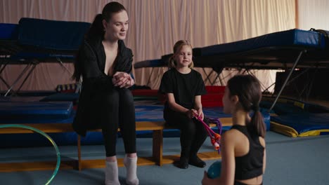 young gymnasts training with their coach