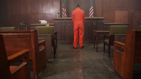 inmate in court room looking sad - law and justice scene