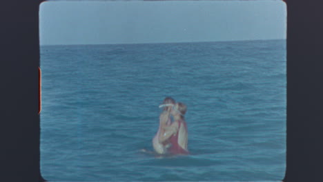 Vintage Super 8 Footage of People Swimming and Splashing in the Ocean
