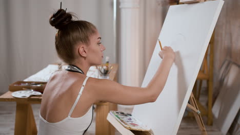 woman drawing with a pencil