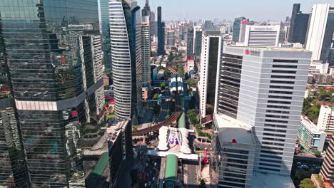 drones fly over the buildings and business districts in bangkok
