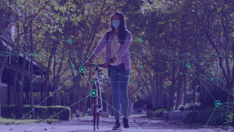 woman pushing bicycle on tree-lined walkway, displaying technology network with turquoise nodes