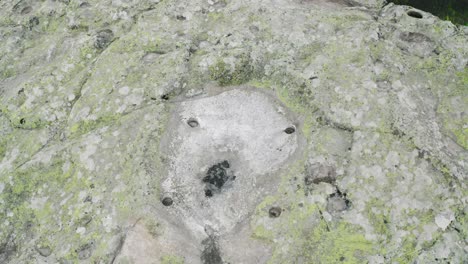 ascending drone shot showing the top view of belintash plateau, located southeast of assenovgrad in the mystical rhodope mountains in bulgaria