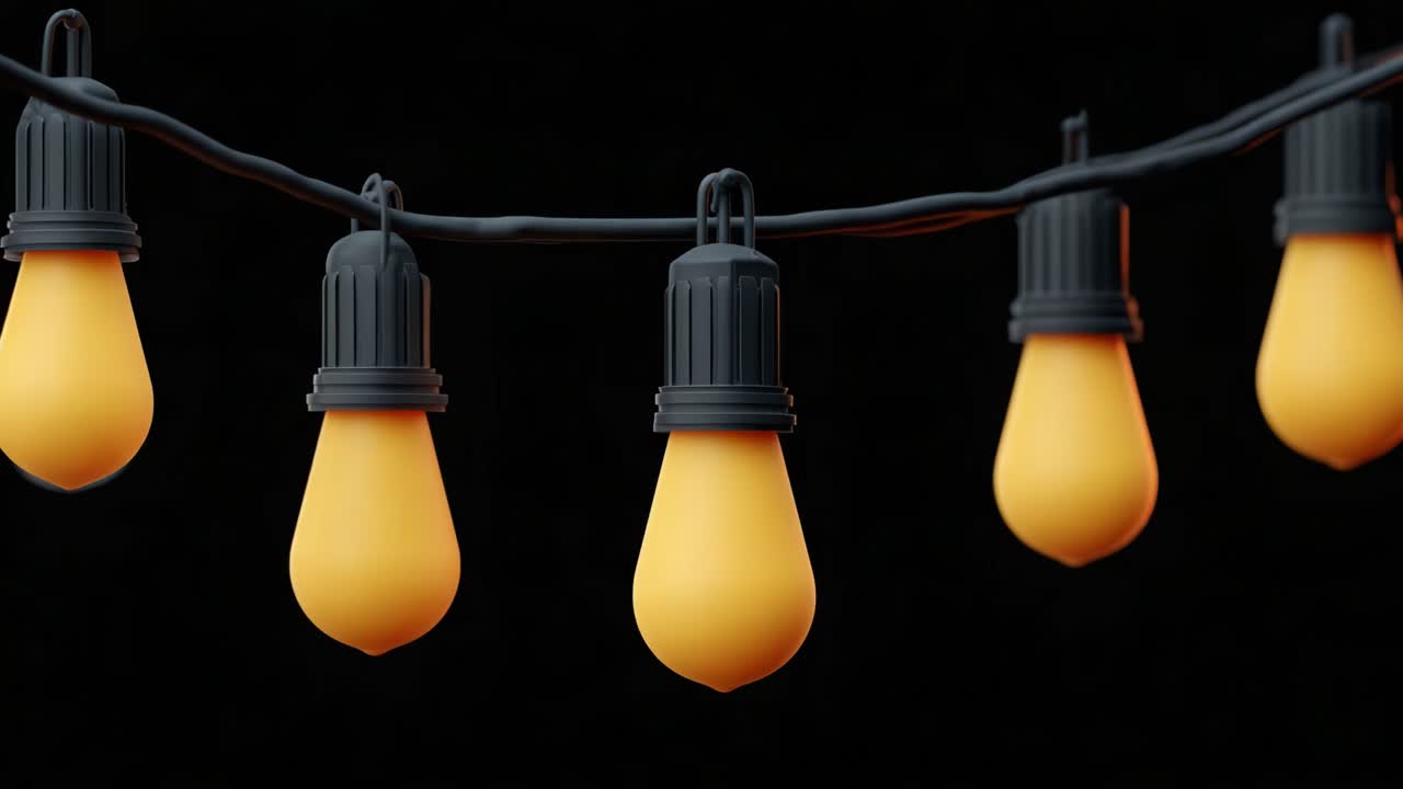 A beautiful sequence showcasing glowing yellow string lights against a black background, highlighting the warm ambiance and decorative potential of illuminated bulbs