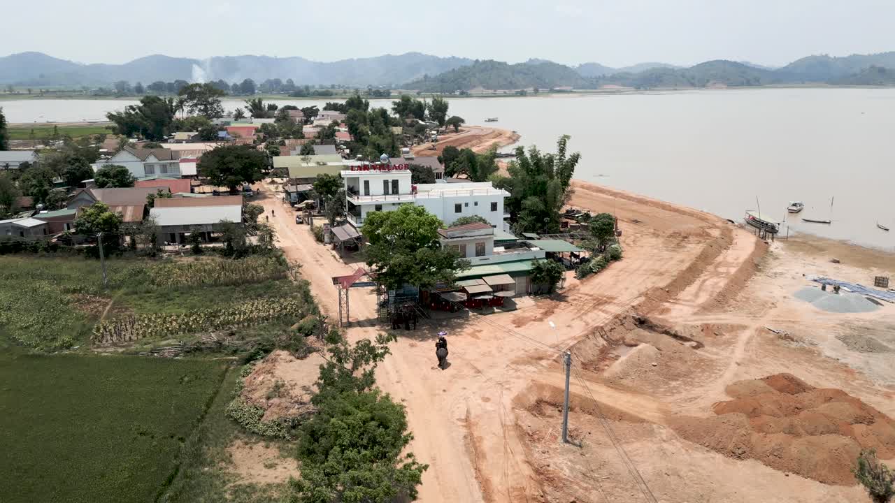 Aerial View of a Village by a River Undergoing Construction