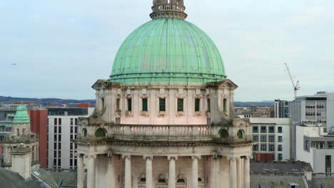descending drone footage from dome to detailed pediment sculptures on belfast city hall