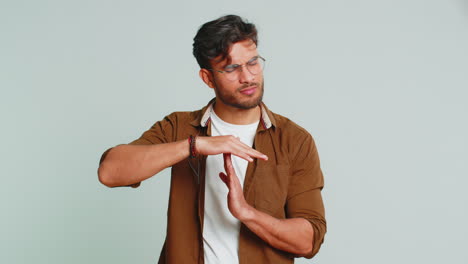 tired upset indian man showing pause gesture, limit or stop sign, time out, take a break relax, rest