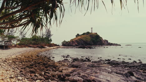 coastal scenery with lighthouse and beach