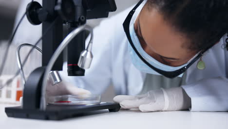 scientist, blood sample and microscope for covid