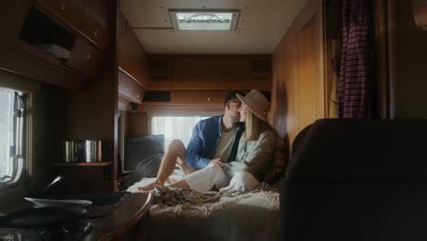 couple enjoying a moment in their camper van