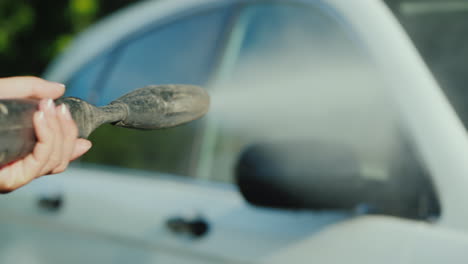 Wash-The-Car-With-A-High-Pressure-Washer-The-Nozzle-From-Where-Water-Escapes-Is-Visible-In-The-Frame