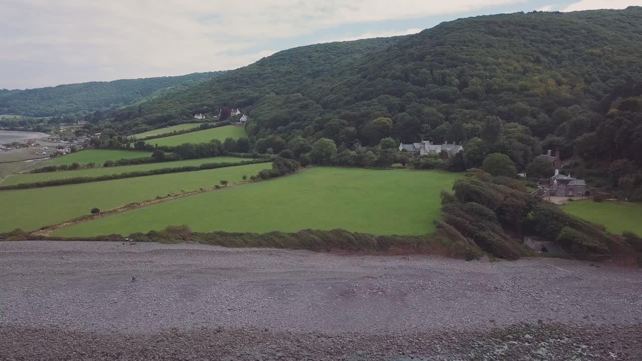 Scenic view of a beach, hills, and countryside landscape