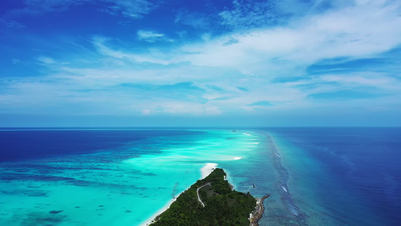 Tropical island and coral reef on a sunny day. Pristine nature, Maldives