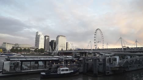 london skyline at sunset from the river thames