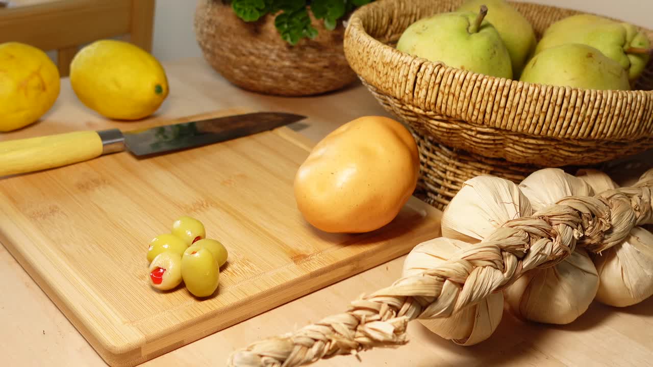Still Life with Lemons, Olives, Potato, and Garlic