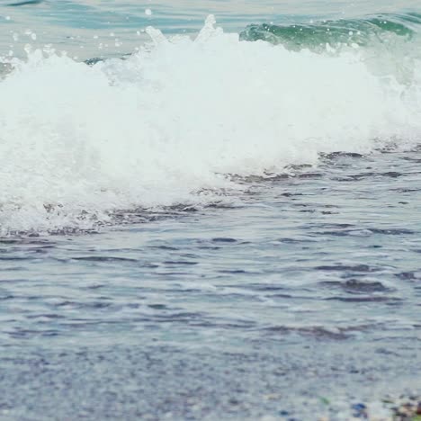 Legs of young woman stepping on sand. Barefoot girl at the sea shore. Summer vacation holiday. Slow motion