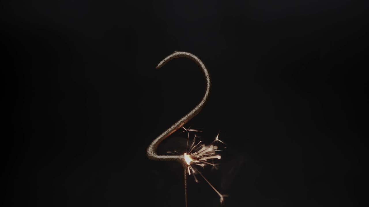 Sparks of fireworks on number two.
