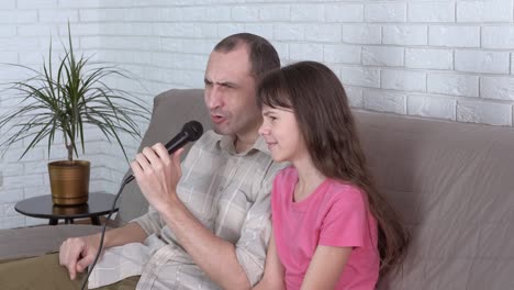 daughter sing with father.