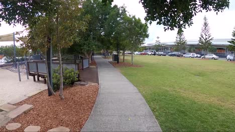 personal perspective of riding a bike or skating on a pathway at a public park