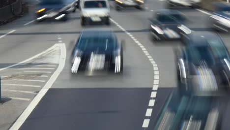 unrecognizable highway exit traffic during the day - long shutter video timelapse style