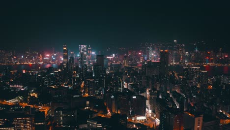 an illuminated city during the night with a lot of skyscraper and advertising sign, cinematic shot like a cyber punk city