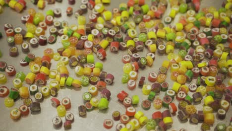 colorful caramel candy bouncing and spreading all over. slow motion