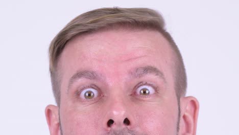 eyes of mature man with blond hair thinking and looking up