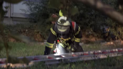 firemen prepairs ladder for rescue mission