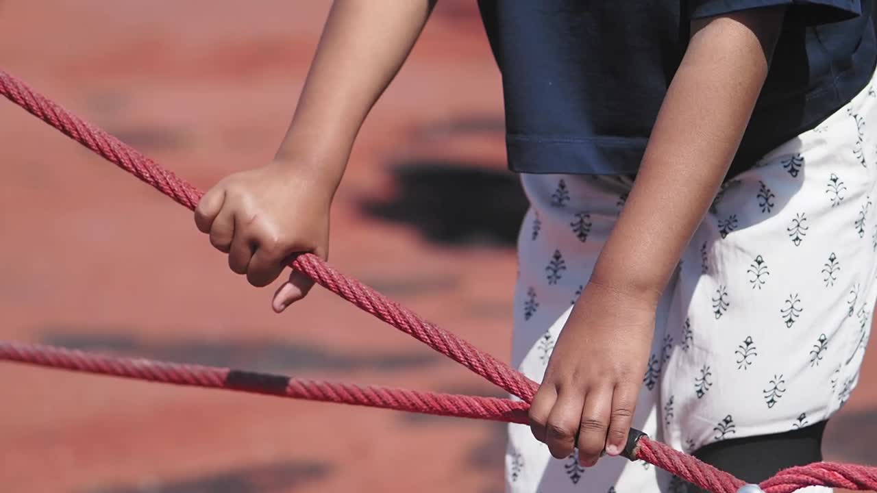 Child playing with rope