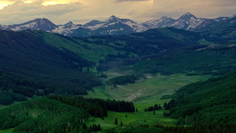 Aerial-of-the-Rocky-Mountains-under-a-moody-sky-as-seen-from-Crested-Butte-near-Boulder,-Colorado,-USA