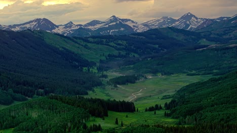aerial of the rocky mountains under a moody sky as seen from crested butte near boulder, colorado, usa