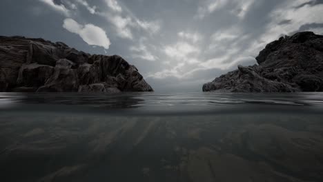 Medio-Bajo-El-Agua-En-El-Mar-Del-Norte-Con-Rocas