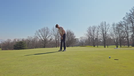 young golfer playing on a sunny spring day in switzerland, showcasing precise chipping, putting, bunker, and approach shots. perfect for sports, lifestyle, and outdoor themes.
