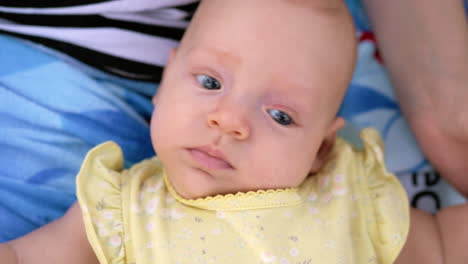 Baby-girl-on-mothers-lap-feeling-her-love