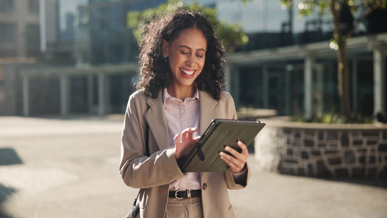 Businesswoman using tablet outdoors