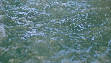 Bubbling-water-inside-a-container,-closeup-shot