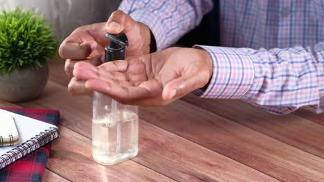 person applying hand sanitizer