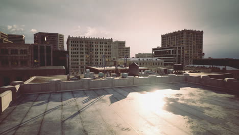 city skyline viewed from a rooftop during sunset with urban architecture