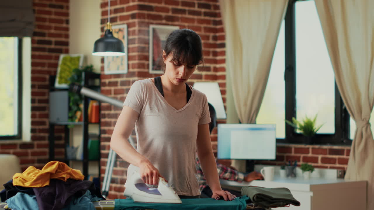 Stressed person throwing blouse at relaxed partner