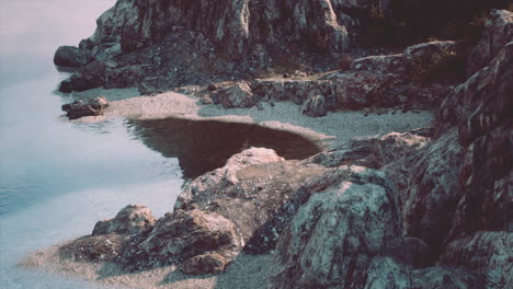 rocky coastline with water reflections