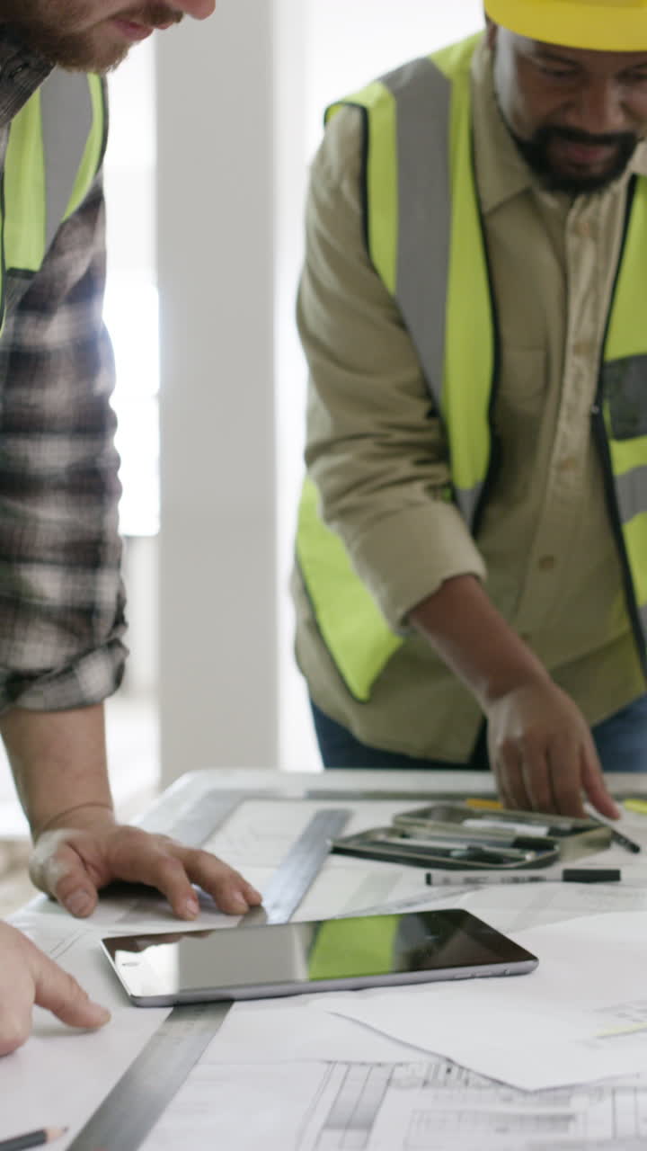 Construction Team Discussing Blueprints and Plans on Site