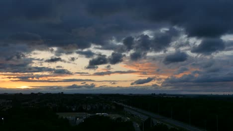 Beautiful-time-lapse-of-sunset-with-view-of-passing-highway