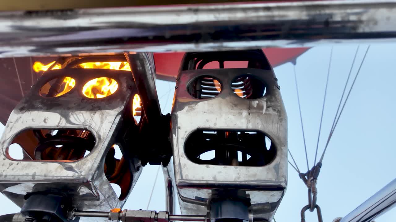 Hot air balloon burner generating flame to heat air for flight