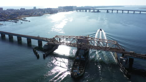 an aerial shot of a swing bridge over s bay in queens, ny