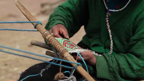 pan of traditional art being woven